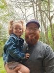 Corey Holland and his daughter smiling