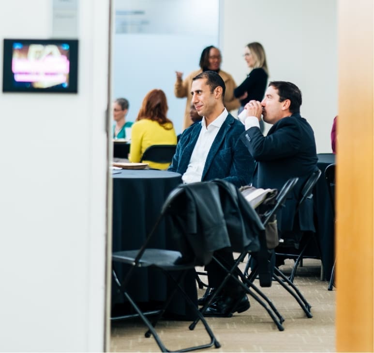 Group of educators sitting in a higher ed classroom